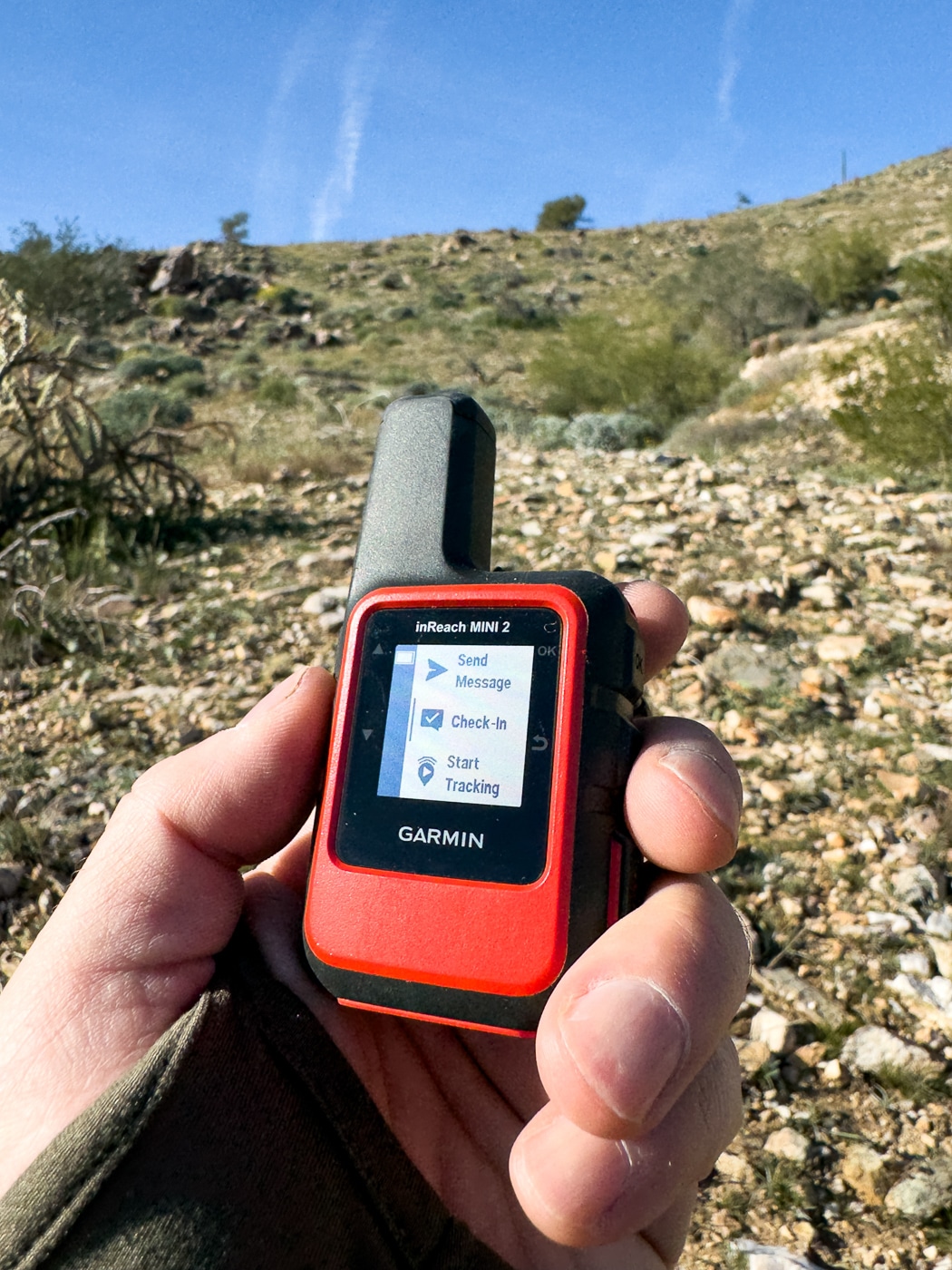 author using the Garmin inReach Mini 2 during testing for this review