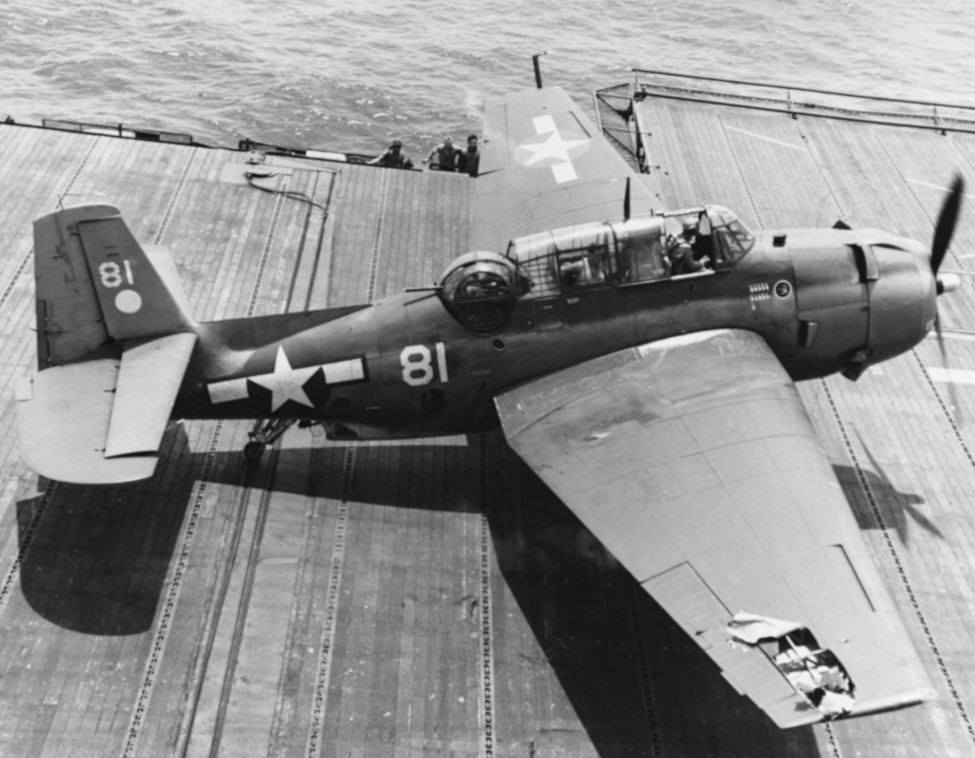 damaged Grumman TBF Avenger on the deck of the USS Hornet CV-12 during Mariana Islands Campaign