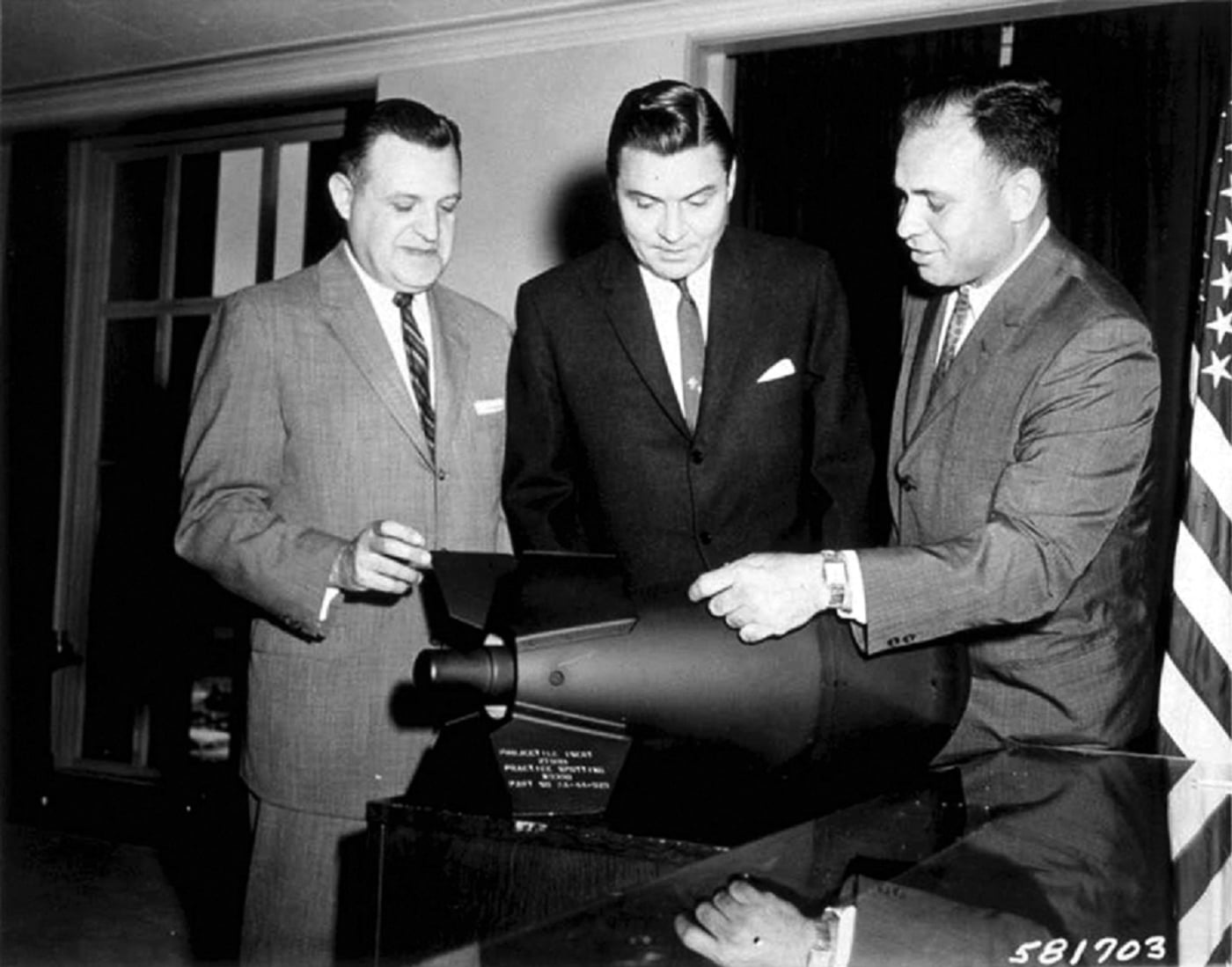 officials examine a W54 nuclear warhead used in the M28 Davy Crocket weapon system
