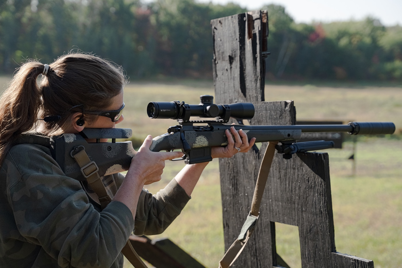 rifle shooter bracing for an accurate shot