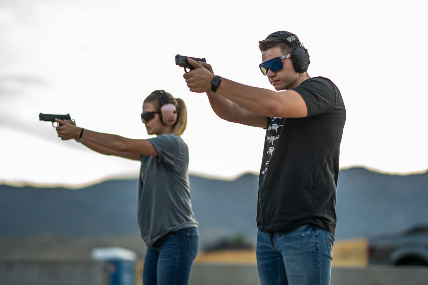 two shooters demonstrating speed and accuracy on the shooting range
