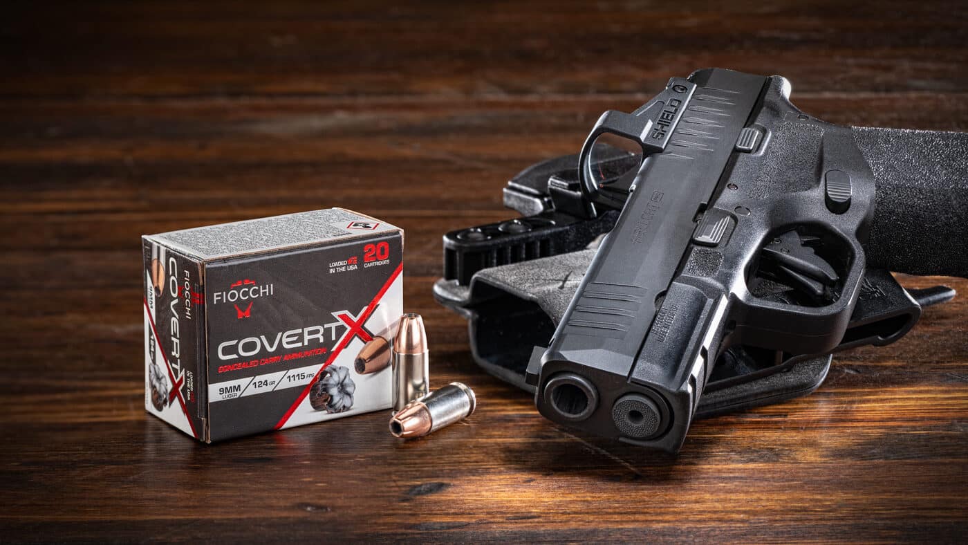 Two boxes of Fiocchi CovertX 9mm 124-gr. JHP ammunition sit next to a Springfield Armory Hellcat Pro pistol with a mounted red dot optic. The CovertX line is Fiocchi's entry into the defensive ammunition market, built around a jacketed hollow point with precut serrations in the lead-alloy core. The heavy copper jacket is engineered for regulated expansion from both short- and full-size handgun barrels. Pairing this load with the Hellcat Pro made sense given the pistol's 3.7" barrel and its popularity as an EDC option. The Fiocchi CovertX 9mm review covered velocity data, gel penetration, expansion, and accuracy testing. Each test was conducted using the same firearm to keep results consistent. Results from this self-defense ammunition would determine whether CovertX earned a spot in my carry rotation.