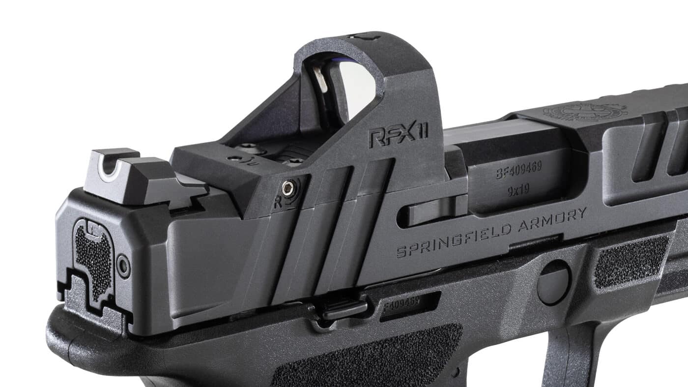 Close-up image shows the Viridian RFX-11 green dot optic mounted on top of a Springfield Armory pistol slide. The Echelon Gear Pac includes a Viridian optic. Shooters benefit from factory-installed red dots. The Springfield Armory Echelon deal removes optic installation hassles. Pistol owners value pre-zeroed sights. The Viridian RFX-11 fits the Echelon slide cuts. Green dot optics improve target acquisition. The Springfield Armory Echelon deal pairs the pistol with matching optics. Gun enthusiasts prefer dedicated optic designs.