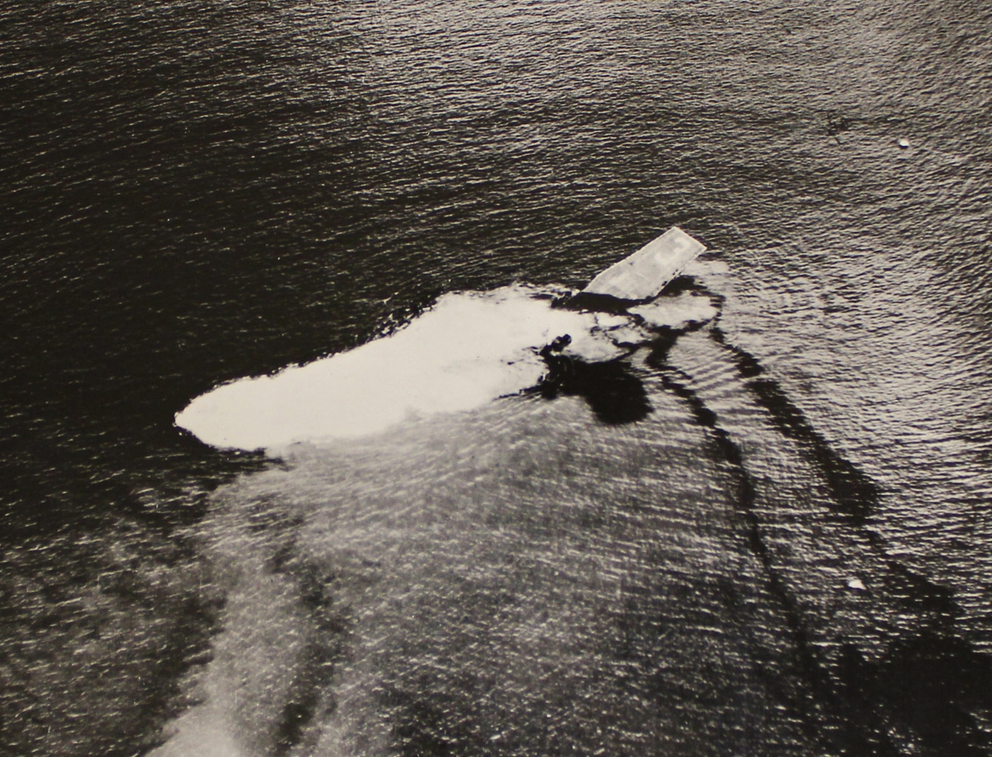USS Saratoga CV-3 sinks beneath the waves during atomic bomb testing