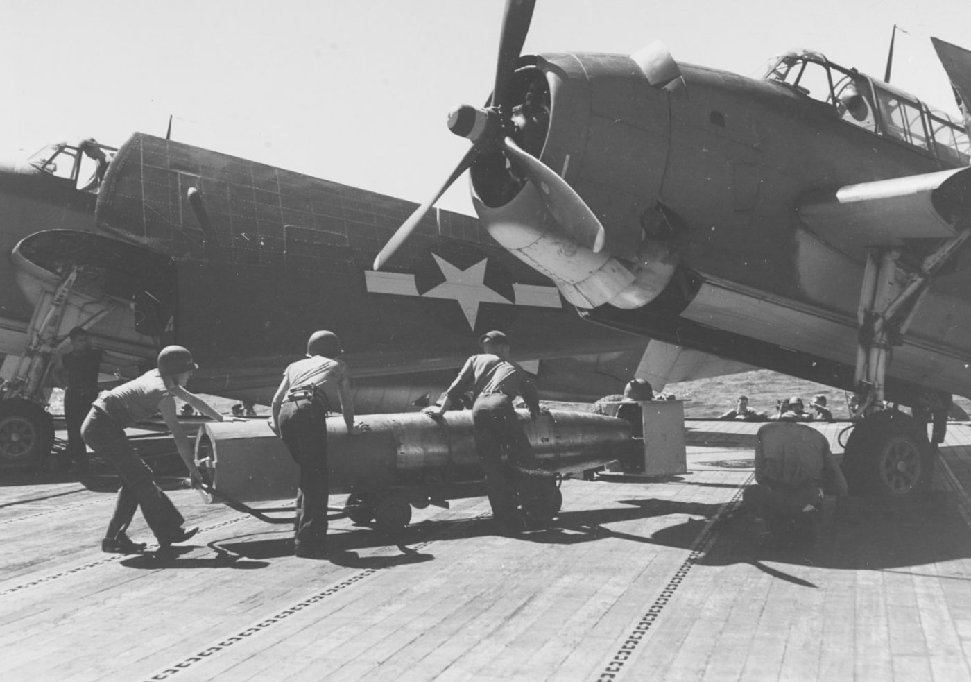 arming a TBM Avenger torpedo bomber on USS San Jacinto CVL-30