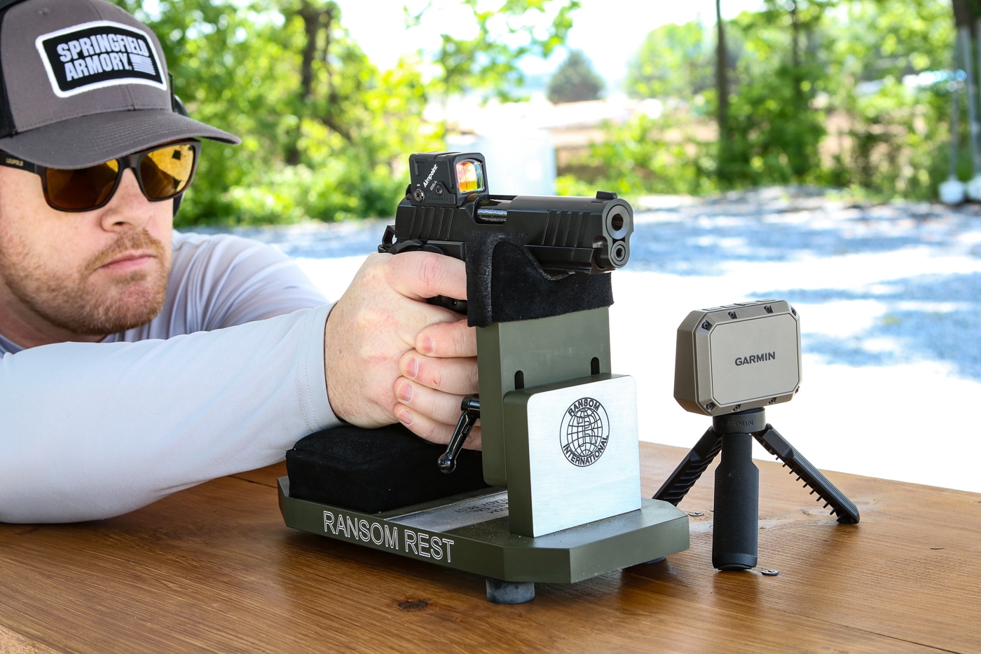 author testing the Springfield Armory Prodigy with a Aimpoint COA red dot sight at the shooting range