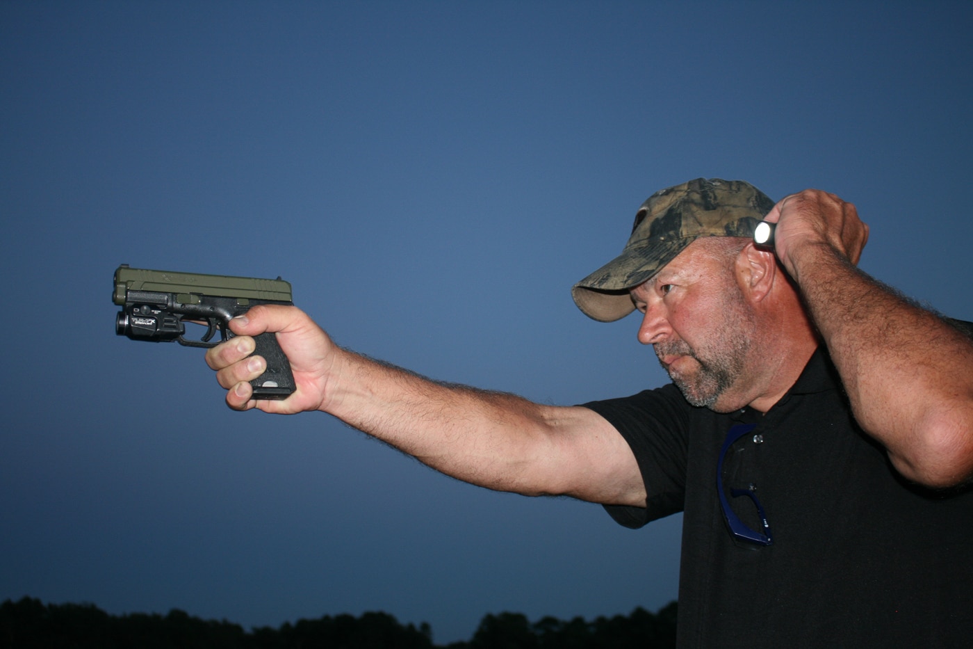 author with neck index flashlight shooting