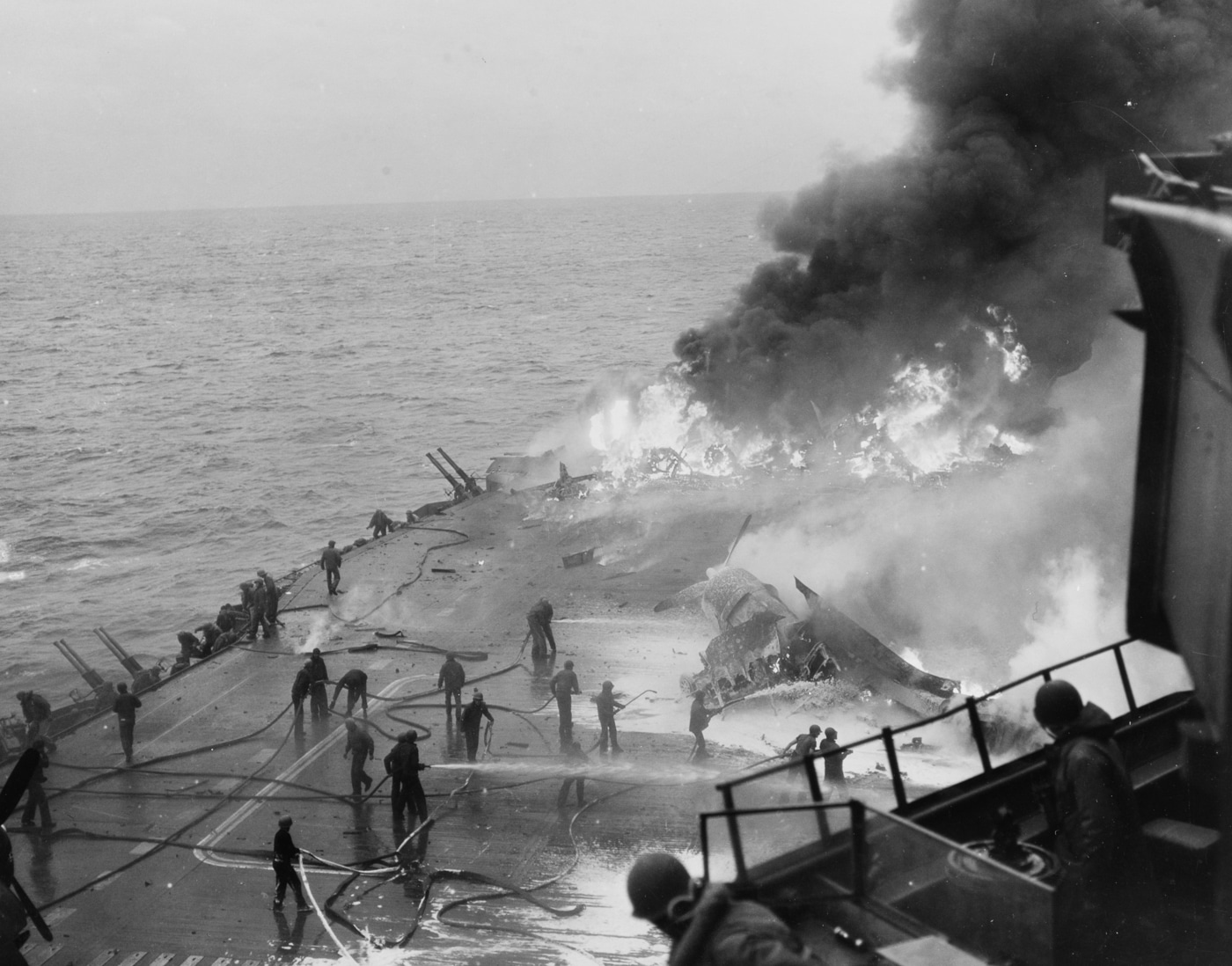 flight deck of USS Saratoga on fire after being hit by kamakazes