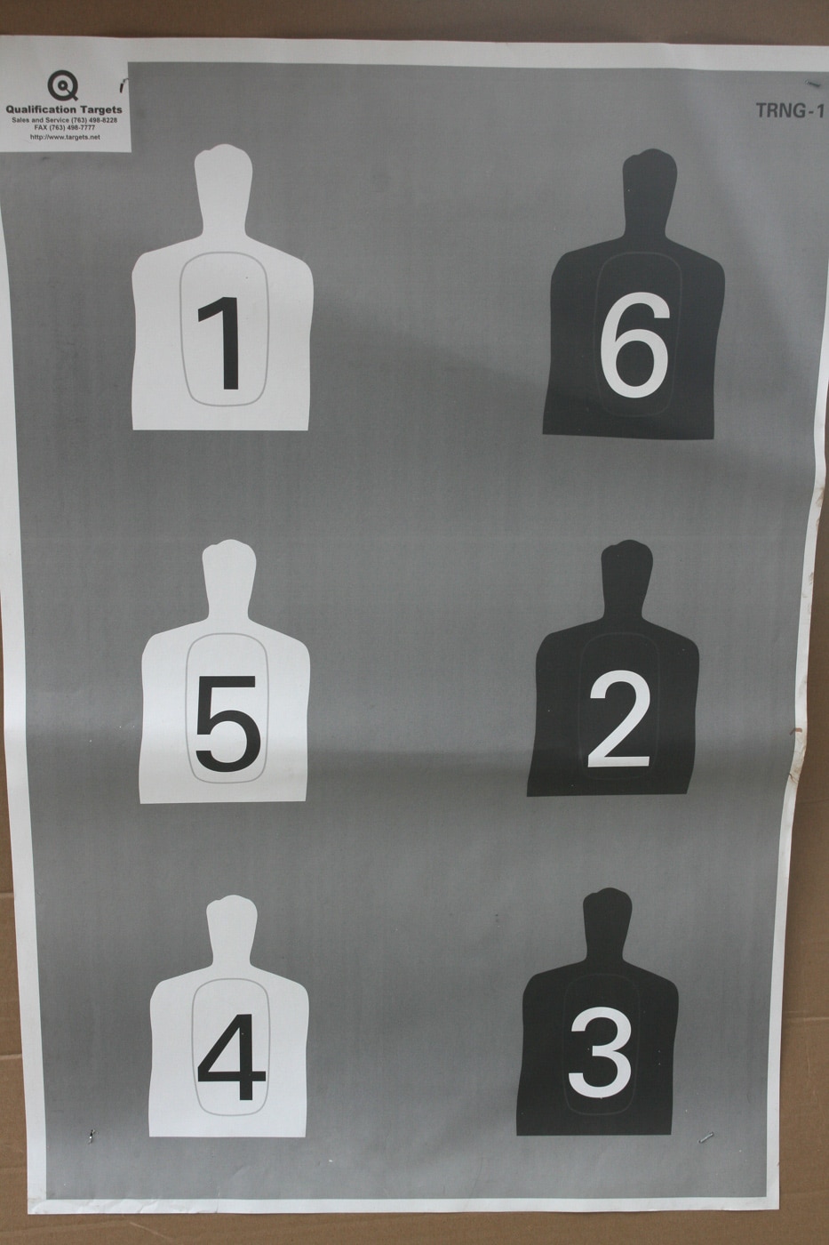 A large paper target displays several humanoid silhouettes arranged side by side, each marked with a clearly visible number. Targets of this design provide an accessible path to judgmental shooting for almost any permit holder with range access. The training partner calls out a number, and the armed citizen must locate the correct silhouette before engaging it with accurate hits. This kind of work brings cognitive load into a setting that might otherwise allow only static marksmanship practice. Sound shooting fundamentals still apply, but they are layered on top of real identification work. Concealed carriers who add this format to their training build the mental habit of confirming the right target before the trigger ever moves.