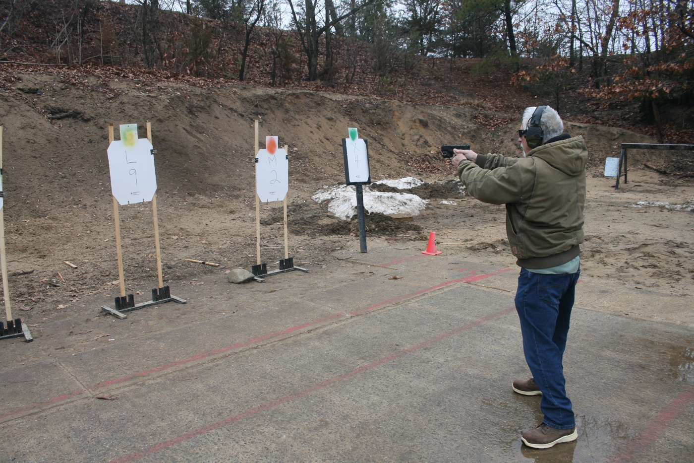 A shooter delivers rounds into a designated silhouette target on a shooting range after receiving a verbal command from a nearby instructor. Engaging on a called cue rather than a tone forces visual identification before any shots are fired. The armed citizen must locate the correct target among several, confirm the designator, and then press the trigger with accuracy. This pattern of see, decide, and act mirrors what a real defensive encounter would demand from a concealed carrier. Basic marksmanship skills still apply, but they take a back seat to cognitive processing under time pressure. Drills like this one bring genuine judgment work into a setting that might otherwise be limited to static practice.