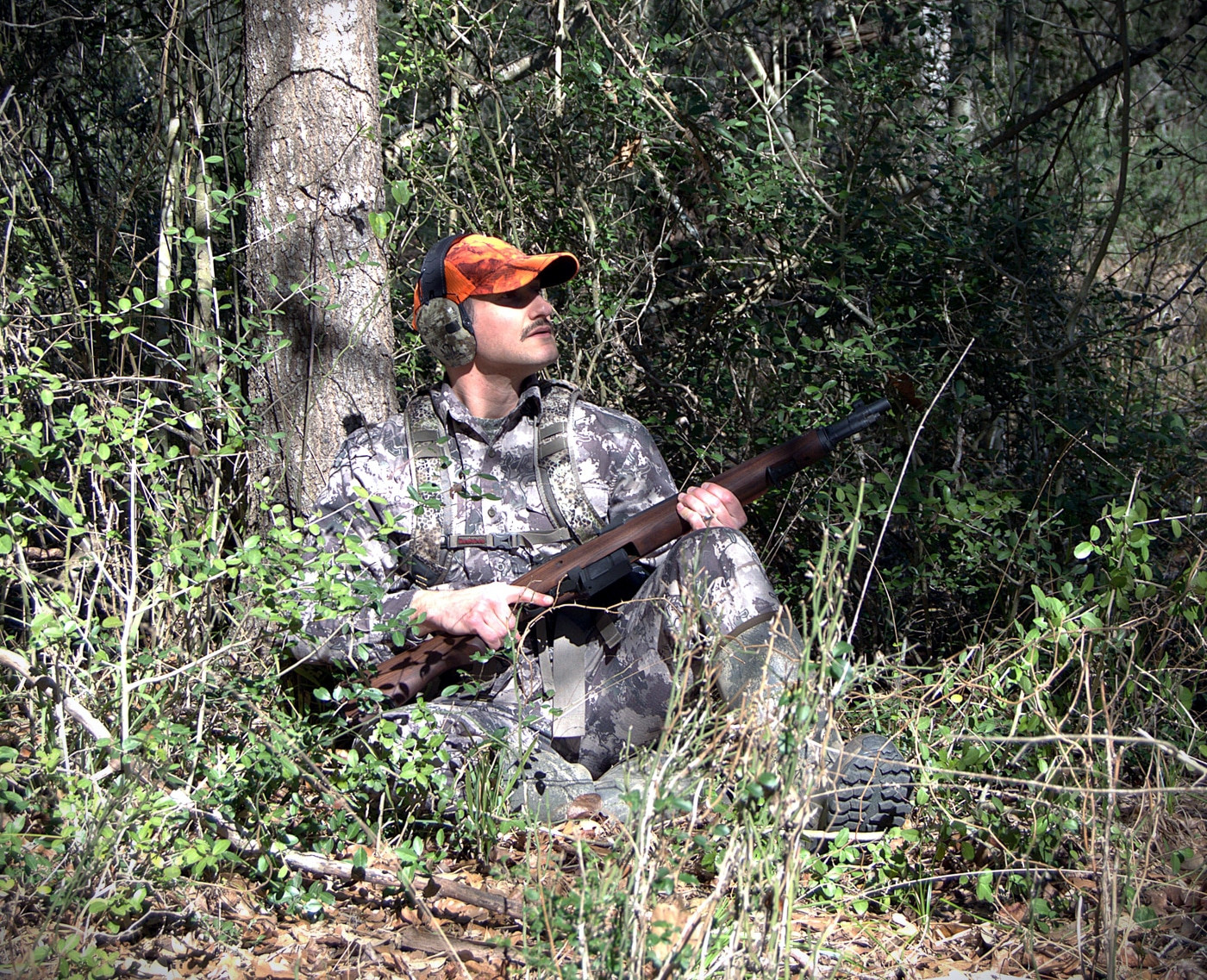 sitting in dense brush with the M1A Tanker testing its ability to maneuver in the woods