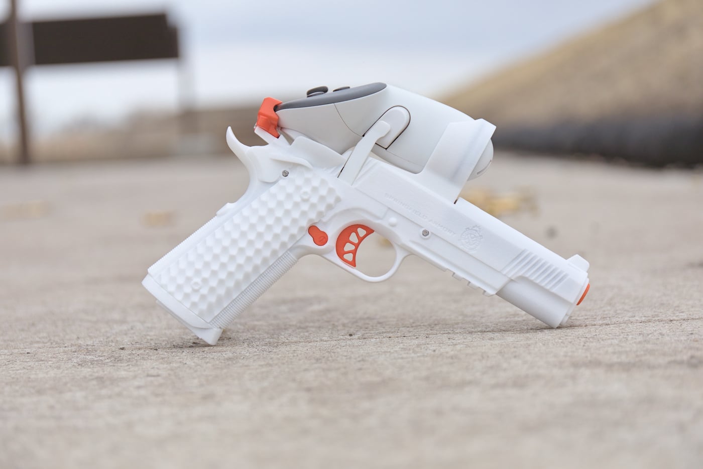 This image shows the Ace 1911 TRP pistol from an alternate viewpoint, rounding out the look at its slide, rail and grip. The handset pairs with a consumer VR headset to form the Ace VR Shooting Simulator. Built as a clone of the Springfield Armory 1911 TRP, it matches the size, texture and trigger pull of the live-fire gun. That congruence is the product of close collaboration between AceXR and Springfield Armory. Viewing the controller from multiple angles makes clear how much the tactile experience drives the virtual trainer. It is a practical illustration of why hardware feel carries as much weight as software in an at-home shooting simulator.