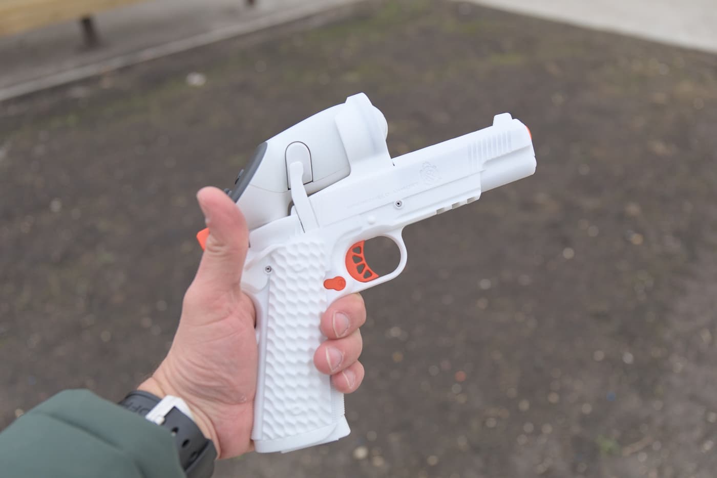 The photo shows the AceXR training handset, a controller built to mimic the Springfield Armory 1911 TRP pistol. This weighted replica is the firearm controller at the center of the Ace VR Shooting Simulator. It matches the size, texture, grip angle and trigger pull of the live-fire 1911 TRP so practice carries over to the real gun. That degree of detail is what makes the virtual shooting trainer useful for building marksmanship fundamentals rather than just entertaining. Configured like the 5-inch rail-equipped variant, it gives 1911 fans a familiar feel in the hand. Springfield Armory and AceXR worked together to keep a high degree of congruence between the handset and the production pistol.