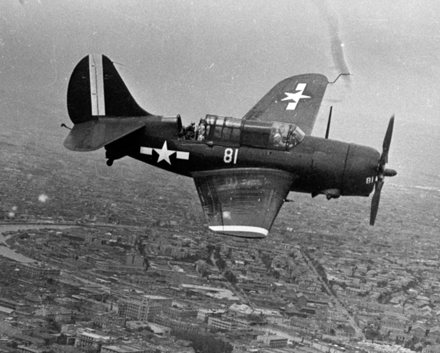 Curtiss SB2C Helldiver flies over Tientsin China