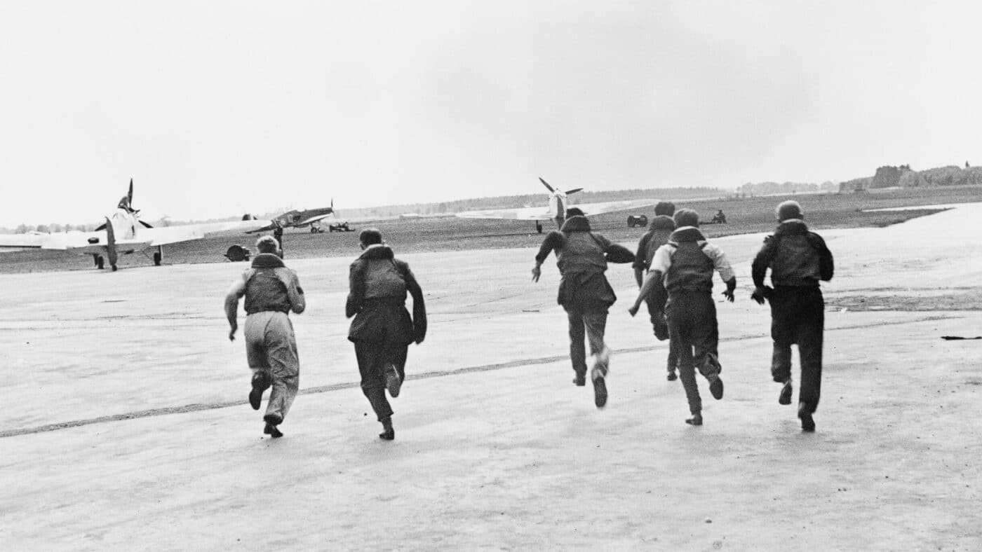 Hawker Hurricane pilots run to their fighter aircraft in July 1940