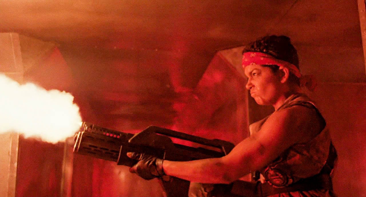 Private Vasquez firing M41A pulse rifle in the movie Aliens