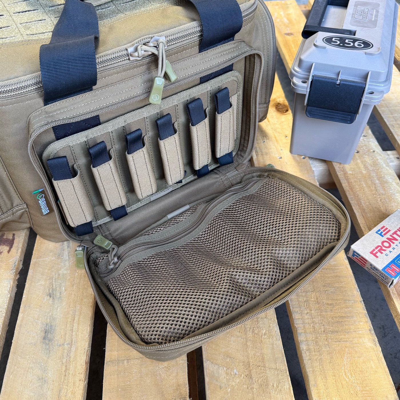 The semi-rigid walls make it easy to reach in and grab eyes, ears, ammo, or optics without digging through a collapsed bag. Padded sleeves protect handguns from contact damage while keeping them ordered within the tactical range bag. Side and front admin pockets hold smaller items like a shot timer, multitool, or pens.