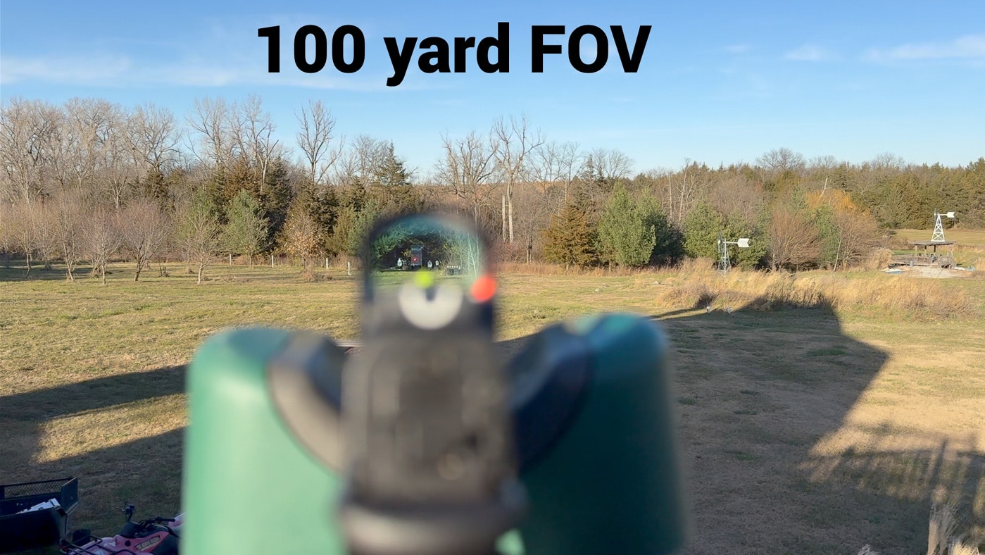 sighting the target through the red dot sight at 100 yards