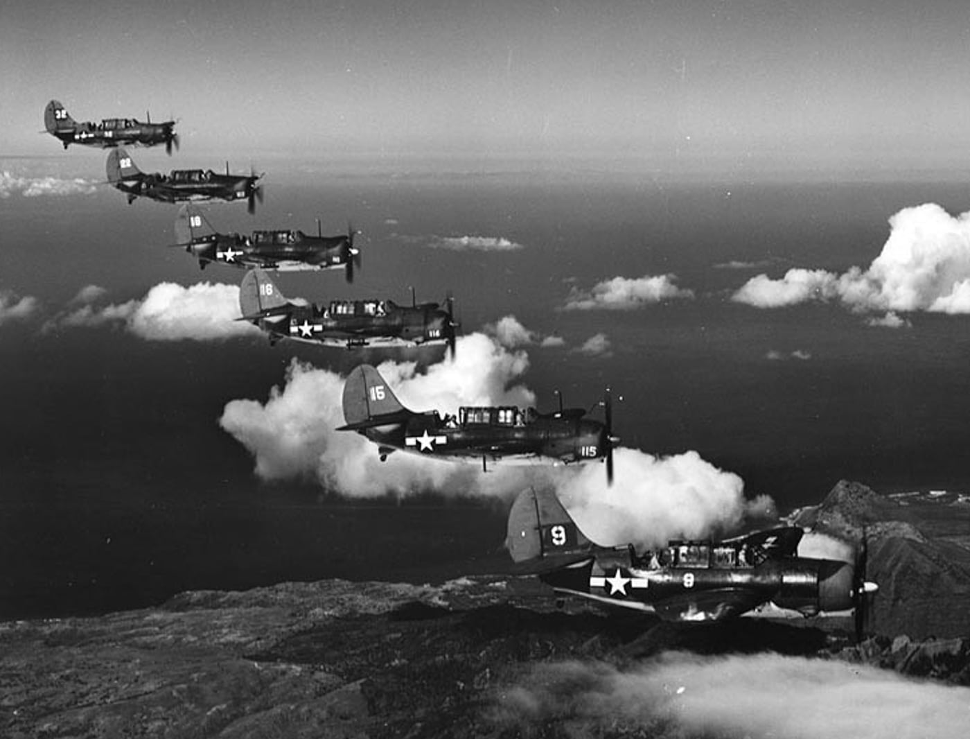 six Curtiss SB2C Helldivers flying in formation during 1944