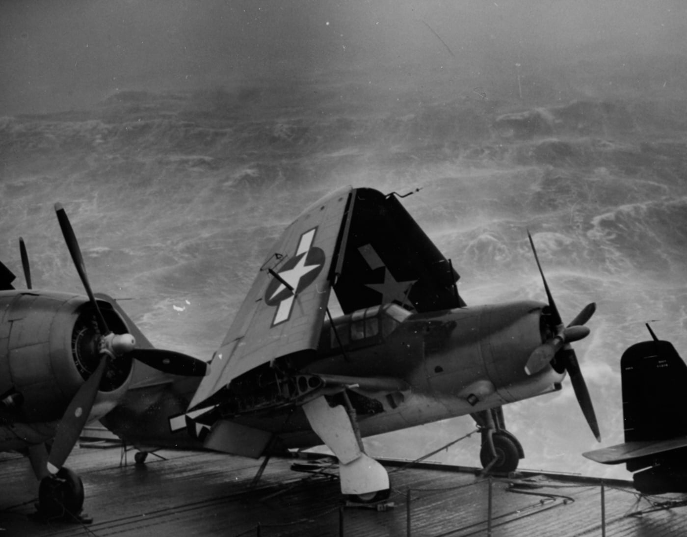 tied down to the deck of the USS Kwajalein CVE-98 during typhoon 1944