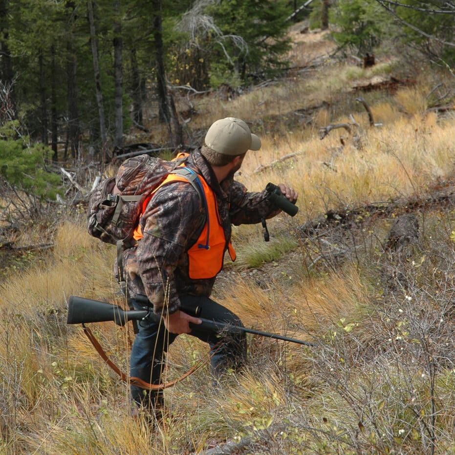 using binoculars on a hunt