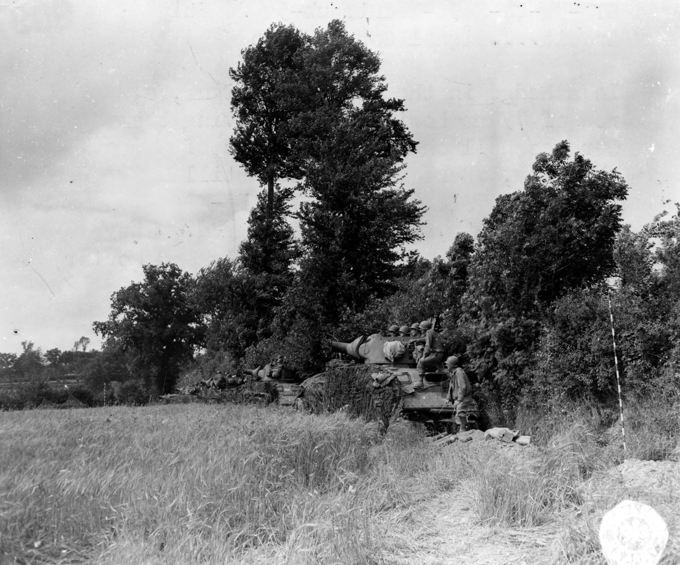 M8 howitzers fire on German observation post overlooking Marigny France July 1944