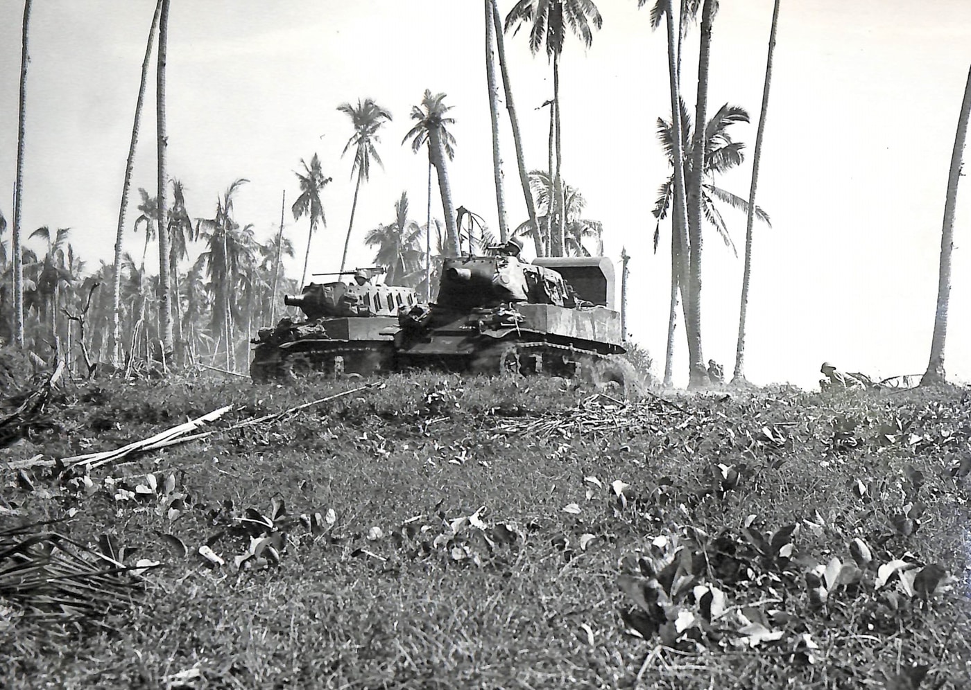 M8 howitzers with snorkels move inland from the beachhead on Leyte Island Philippines