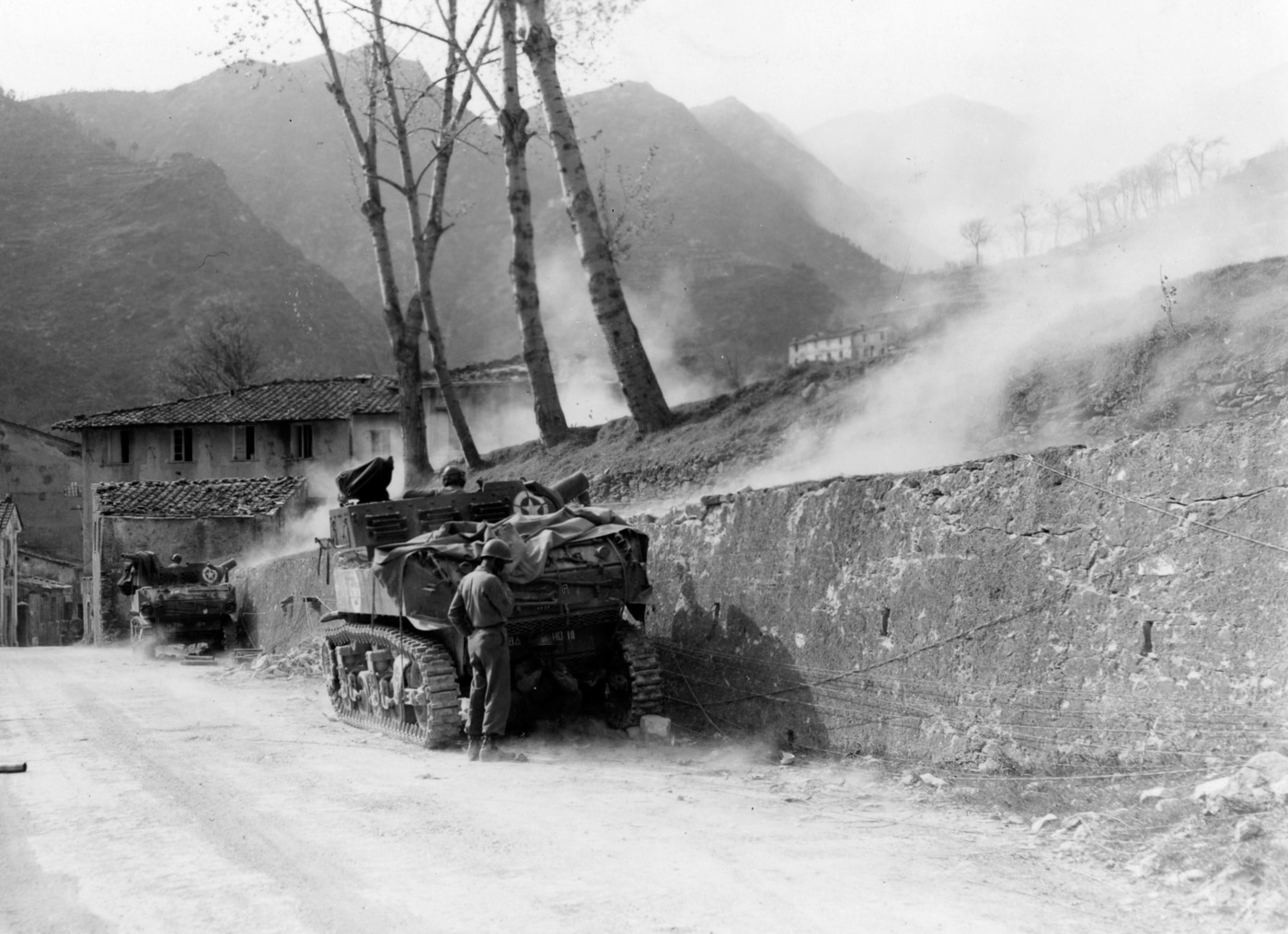 M8 of all Black 758th Light Tank Bn fires on Mt Belvedere