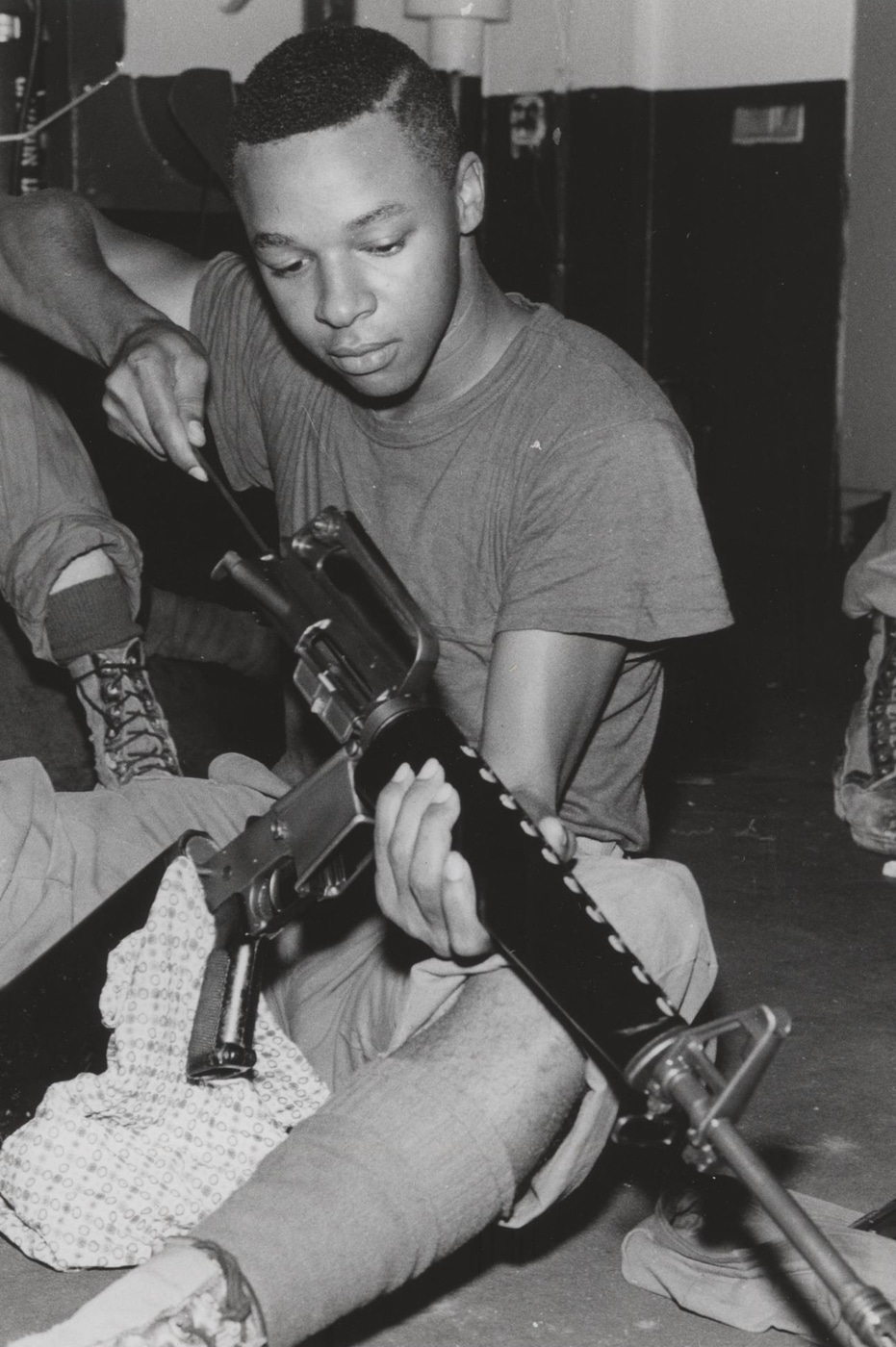 USMC private first class cleaning M16A1 rifle