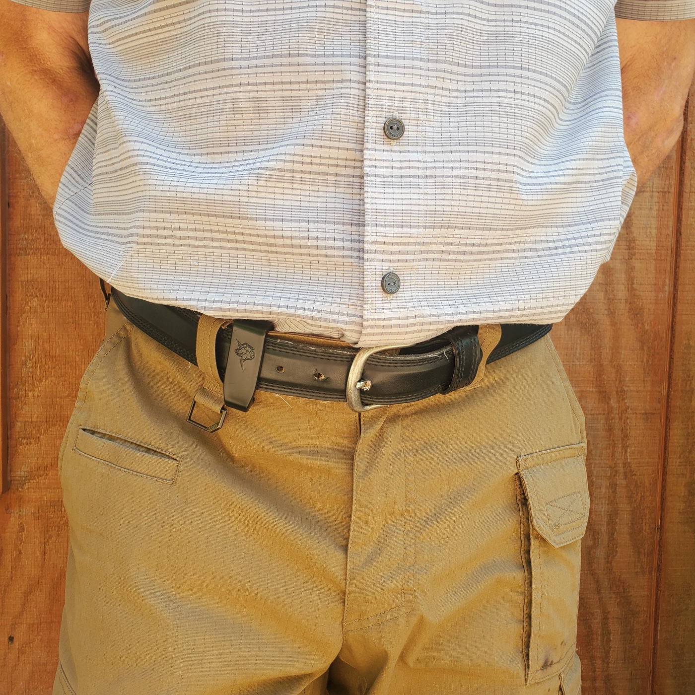 author demonstrating CCW with a dress shirt tucked in over his pistol