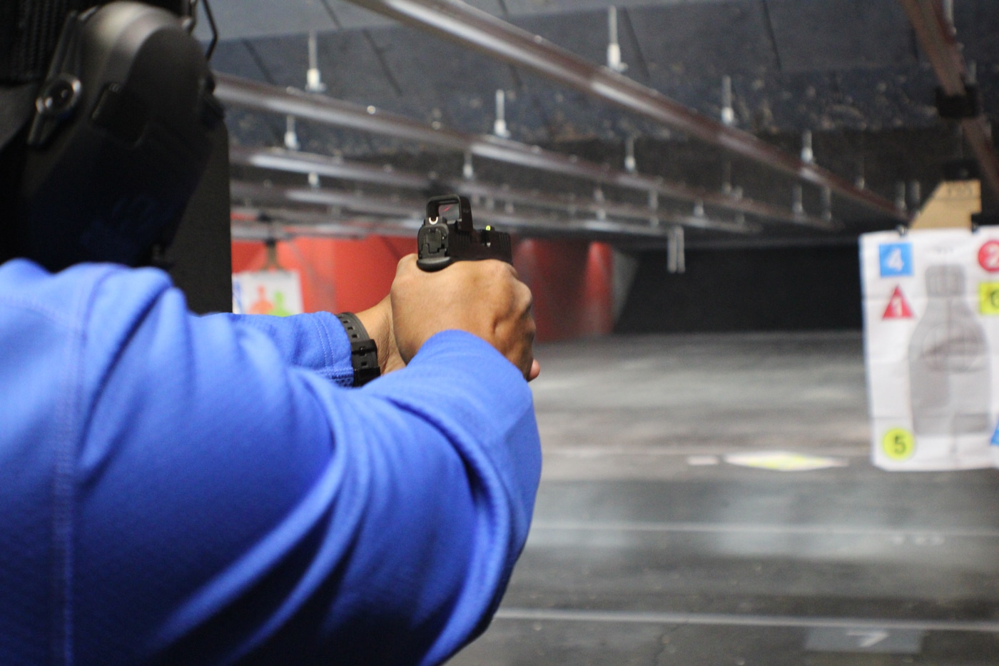 author shooting the Floyd Custom Shop Hellcat Pro on indoor range