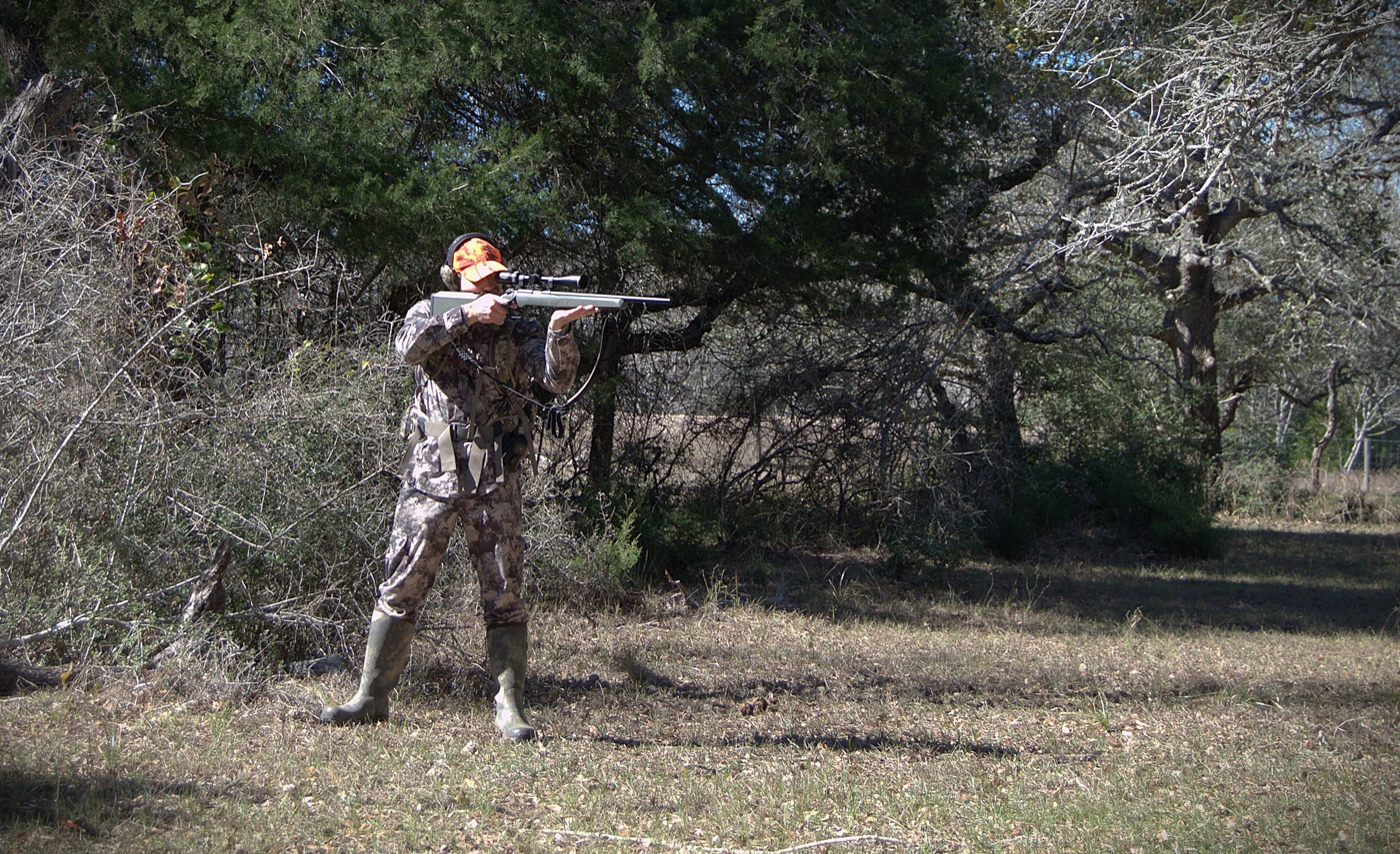 man standing and shooting the Model 2020 Target in the field