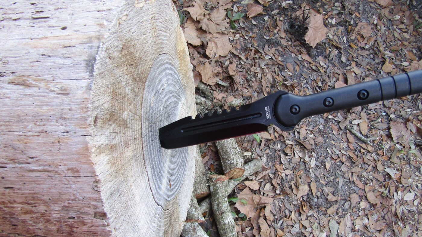 Outdoor use of the SOG Shadow Spear II survival spear in North Florida, showing the durable glass-filled nylon haft and 420 stainless steel tanto point for boar hunting.