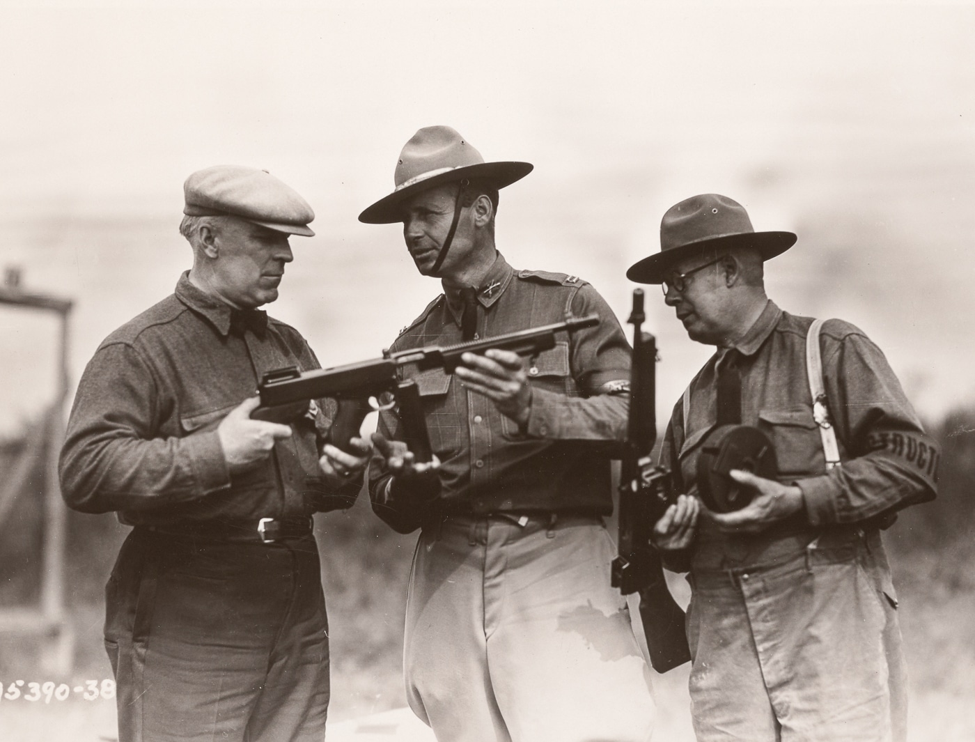 Captain Norris US Army explains the Thompson SMG to Captain Lanrish of Hartford CT police department at National Rifle Matches Camp Perry
