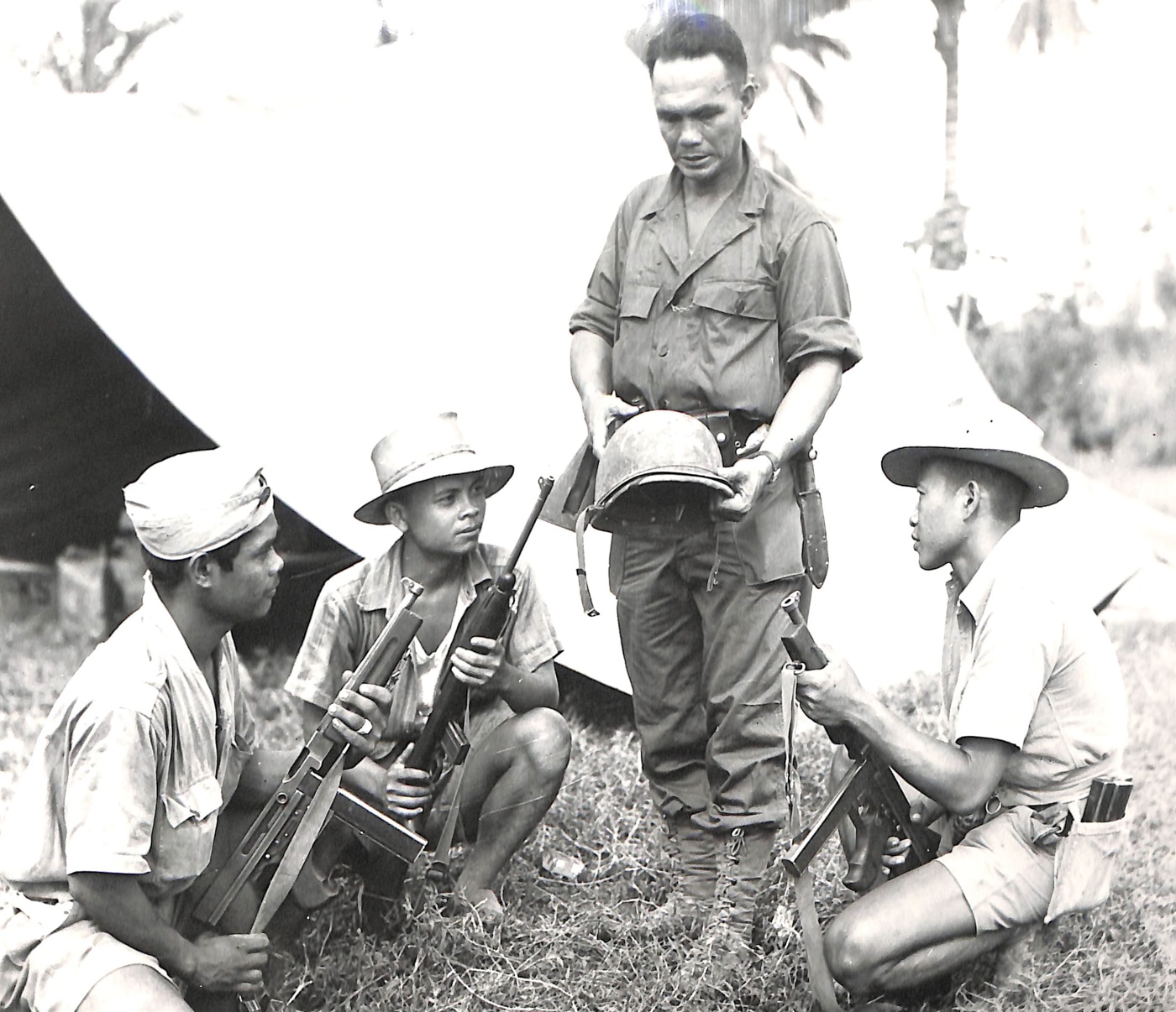 Filipino guerrillas with Thompson submachine guns on Leyte Island Philippines 1944