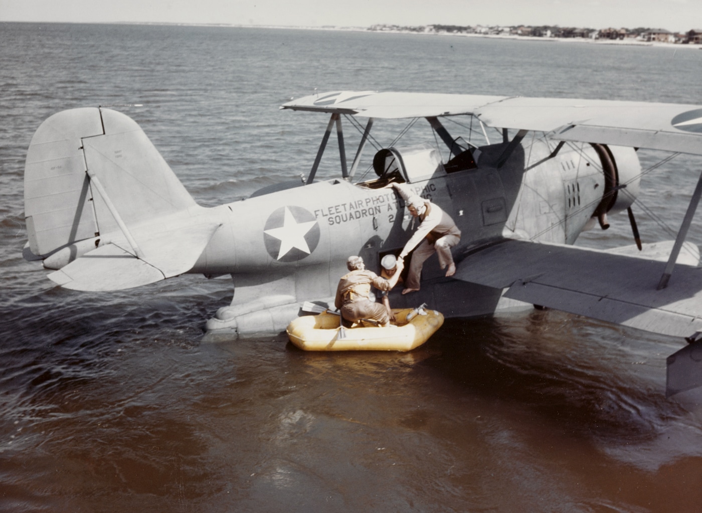 Grumman J2F-2A Duck performs a simulated water rescue of naval aviators during World War II