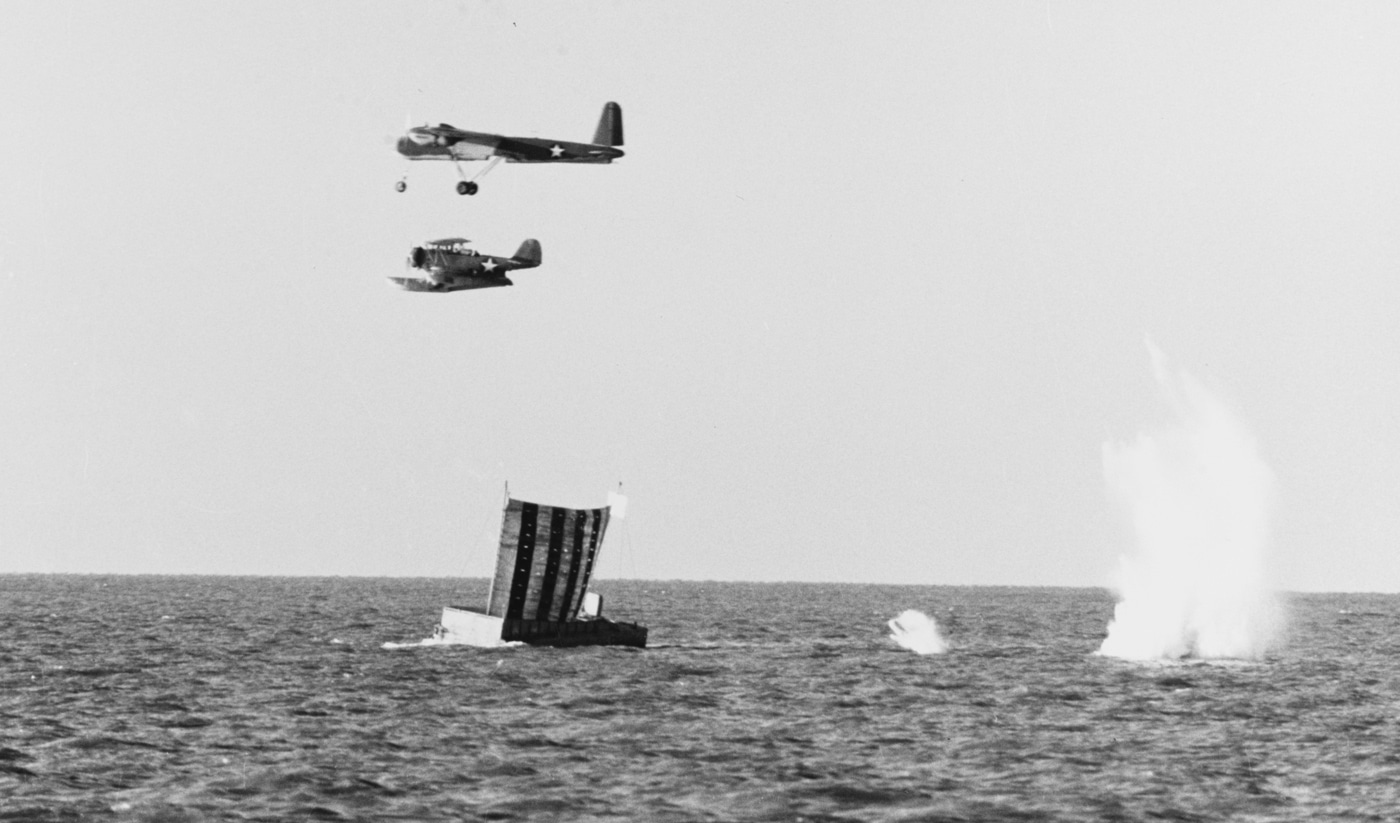 Grumman J2F Duck chase plane follows TDN-1 assault drone during testing in Delaware Bay 1943