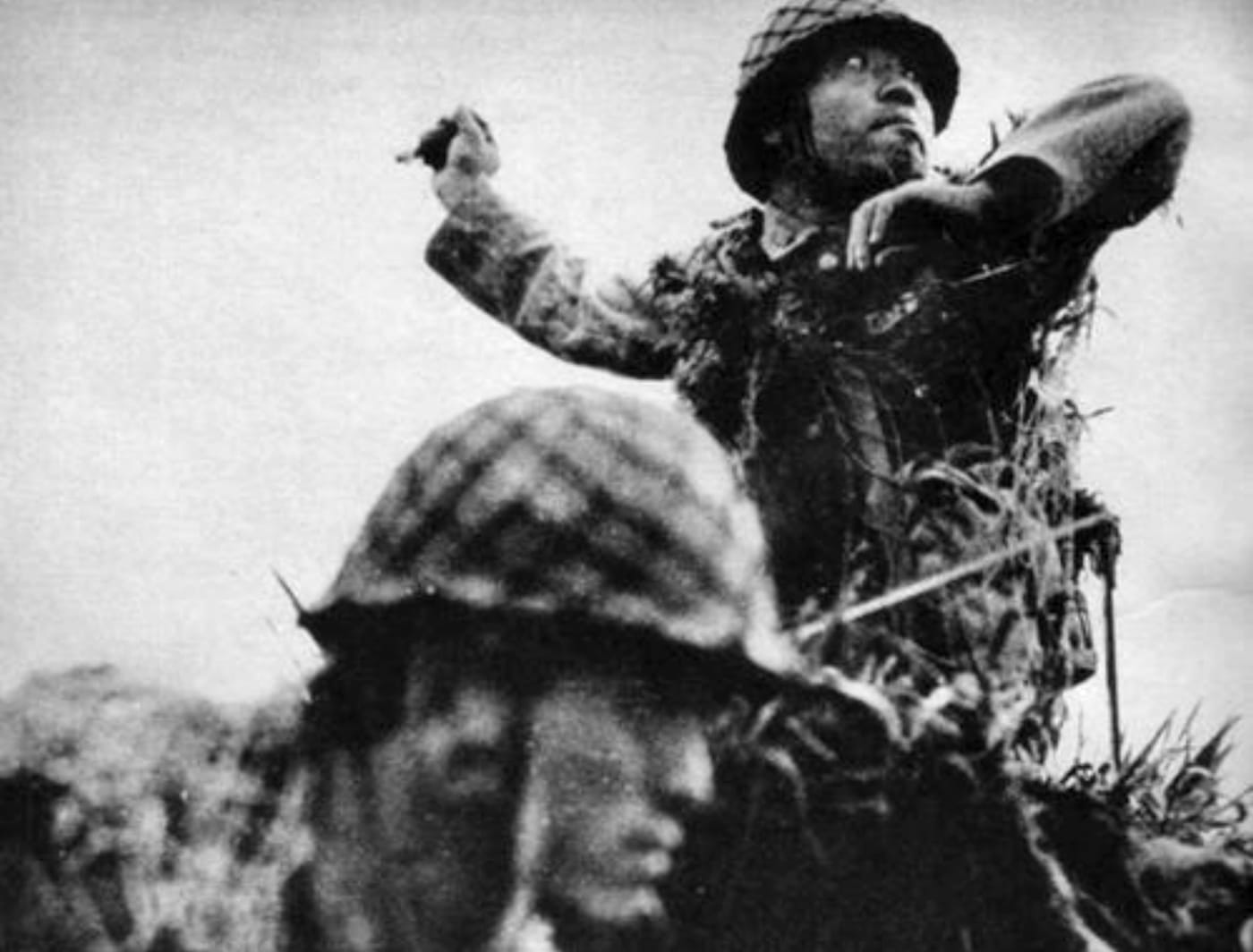 Japanese soldier throws a Type 91 hand grenade during fighting on Guadalcanal in September 1942