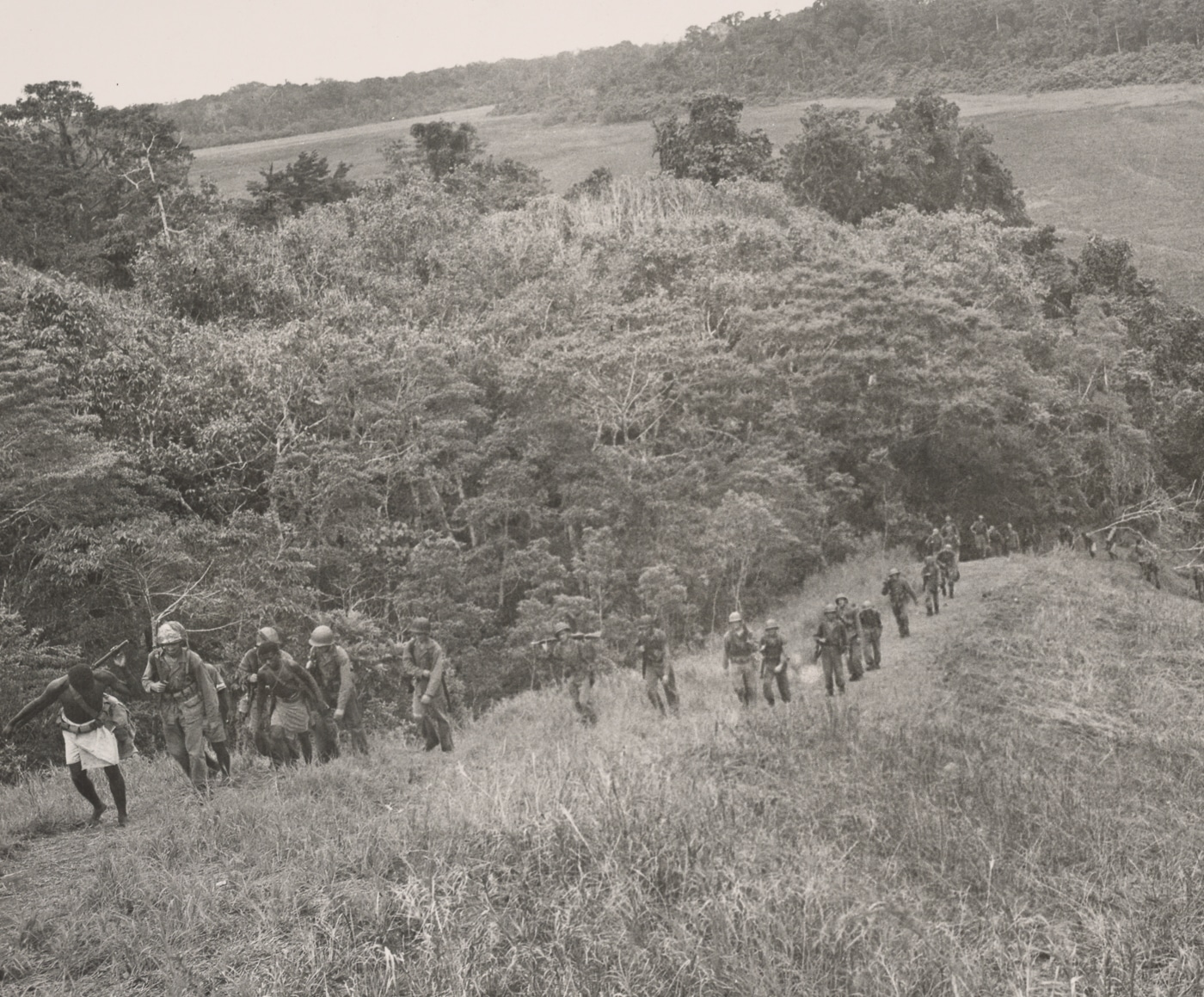 Marine Raider battalion hikes over rugged terrain during operations on Guadalcanal