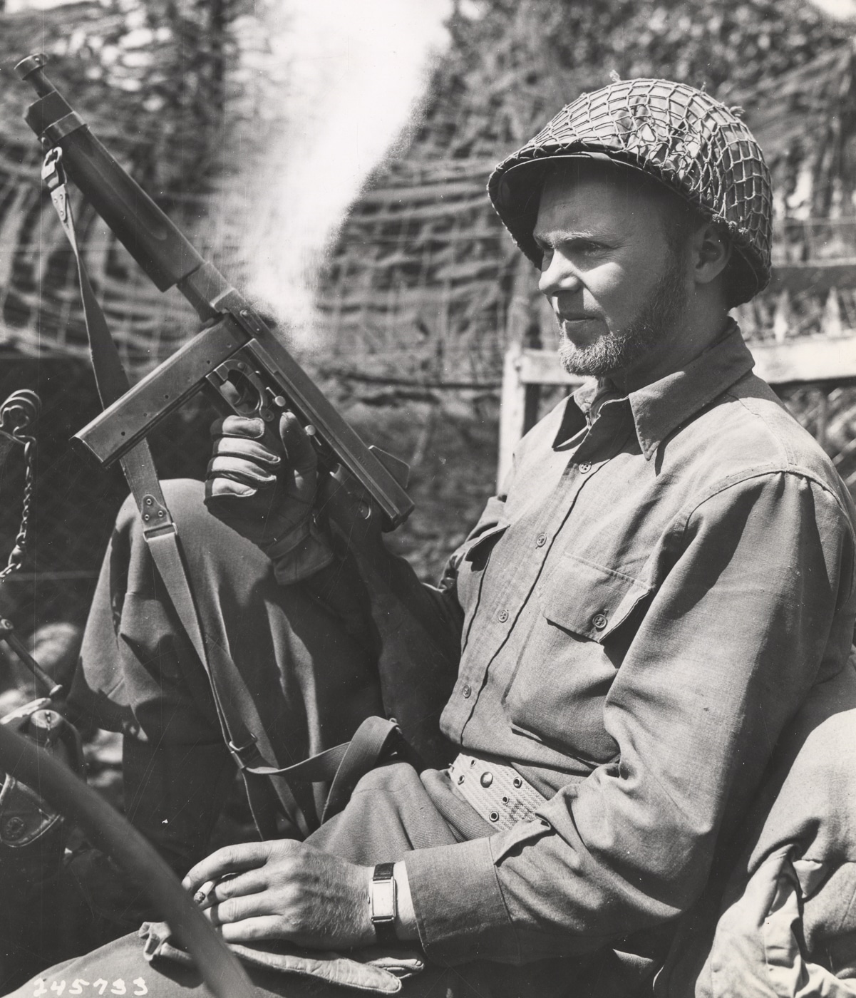 Private Edwin Larsen of 32nd Armored Regiment 3rd Armored Division armed with Thompson submachine gun