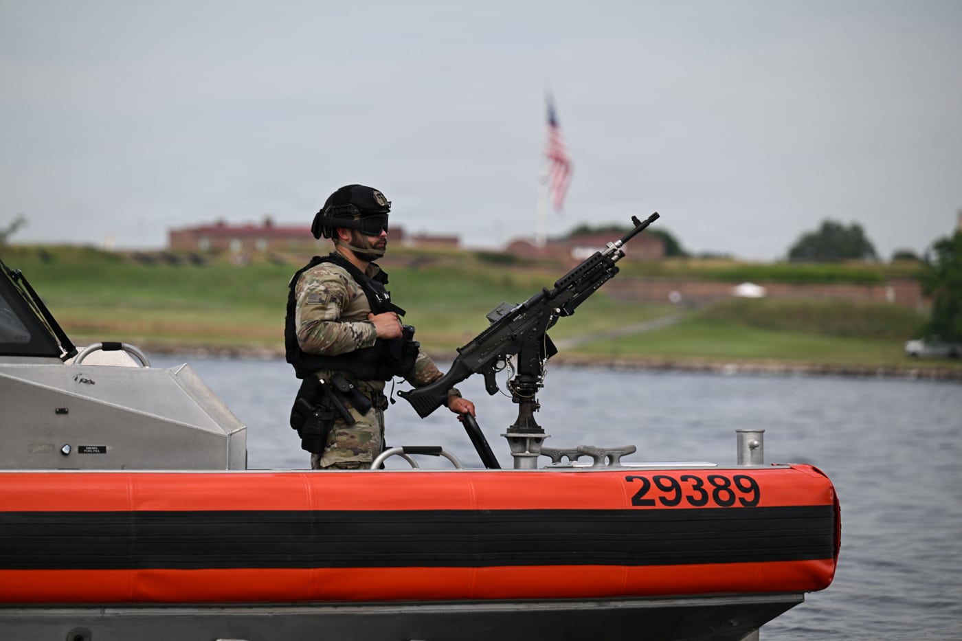 US Coast Guard sailor with M240 machine gun during security operations