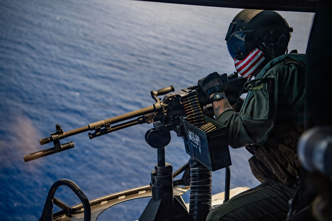 US Marine fires M240D machine gun from UH-1Y Venom helicopter