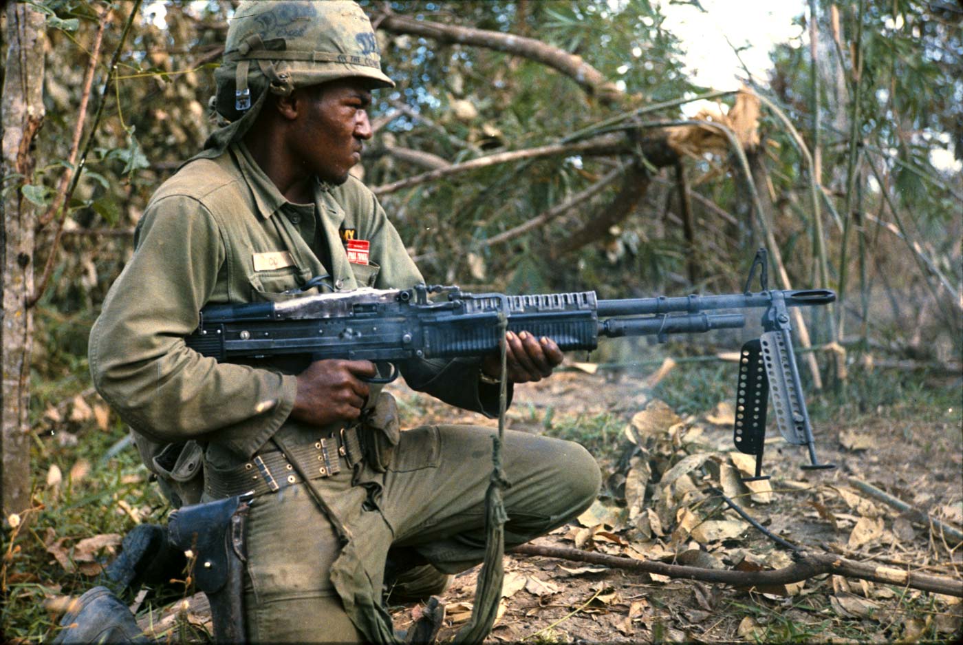 US soldier fires M60 at treeline in Vietnam War