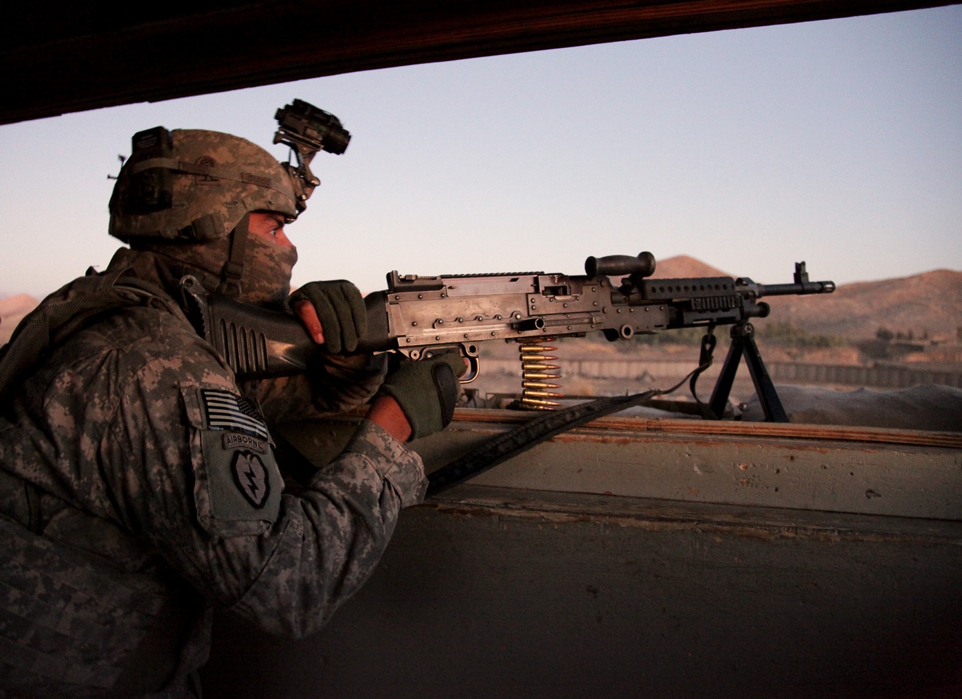 US soldier returns enemy fire with M240 machine gun on Thansgiving 2009 in Khowst Province Afghanistan