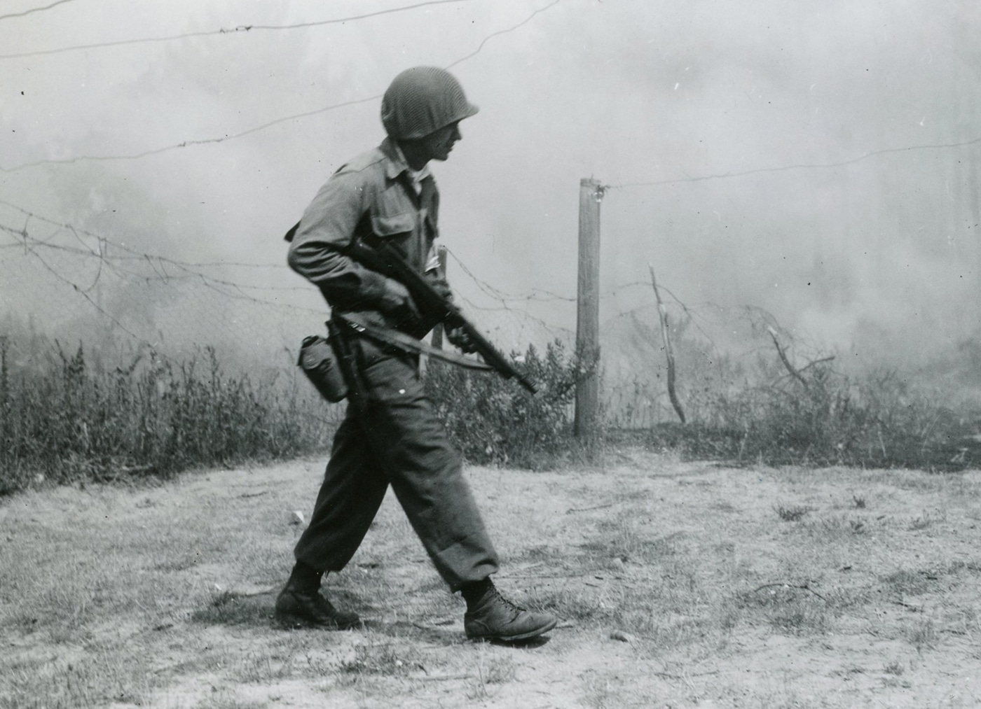 US soldier with Seventh Army carries a Thompson SMG in Southern France