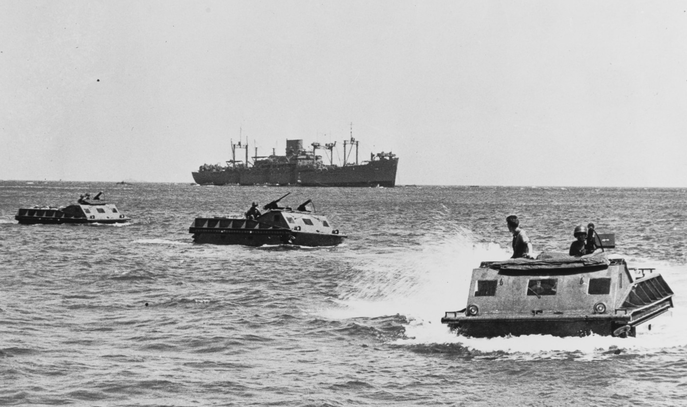 USMC amphibious tractors move toward shore at Guadalcanal