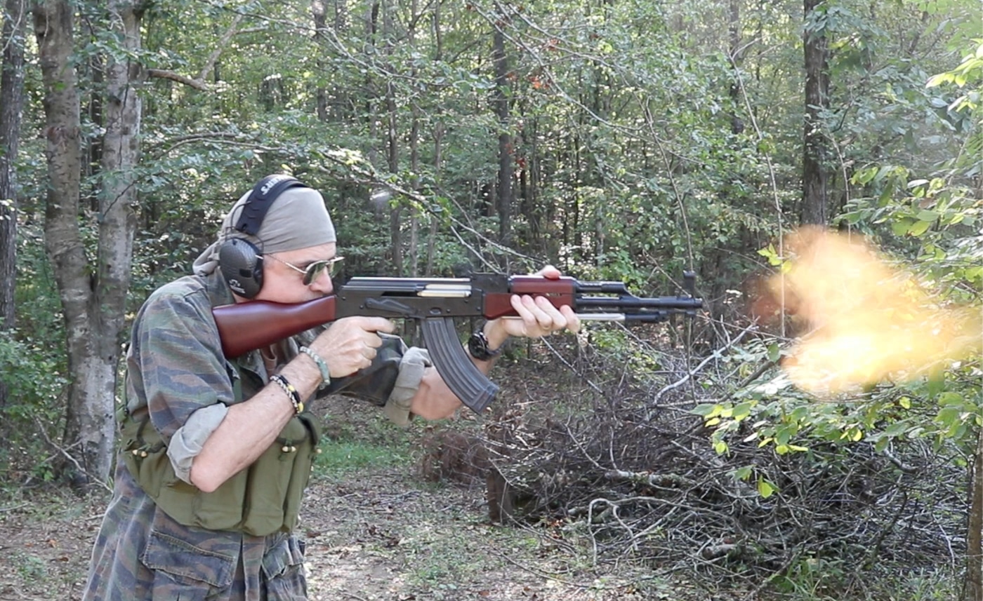 author firing the AK-47 preferred weapon of the enemy which makes a distinctive sound when fired