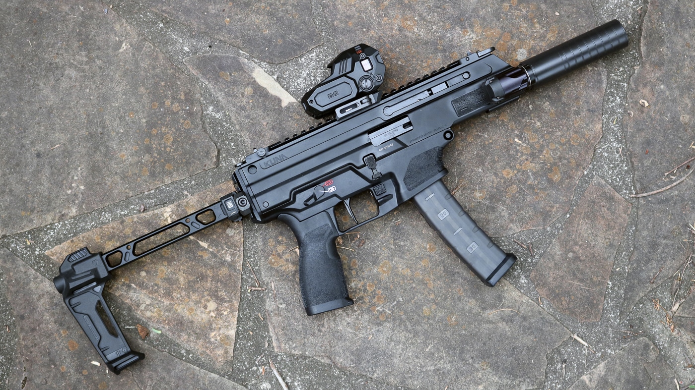 authors Springfield Kuna tri-lug with optic and suppressor