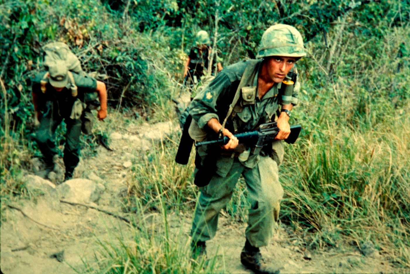 color photo of US soldiers of 502nd Infantry conducting search and destroy mission searching for Viet Cong