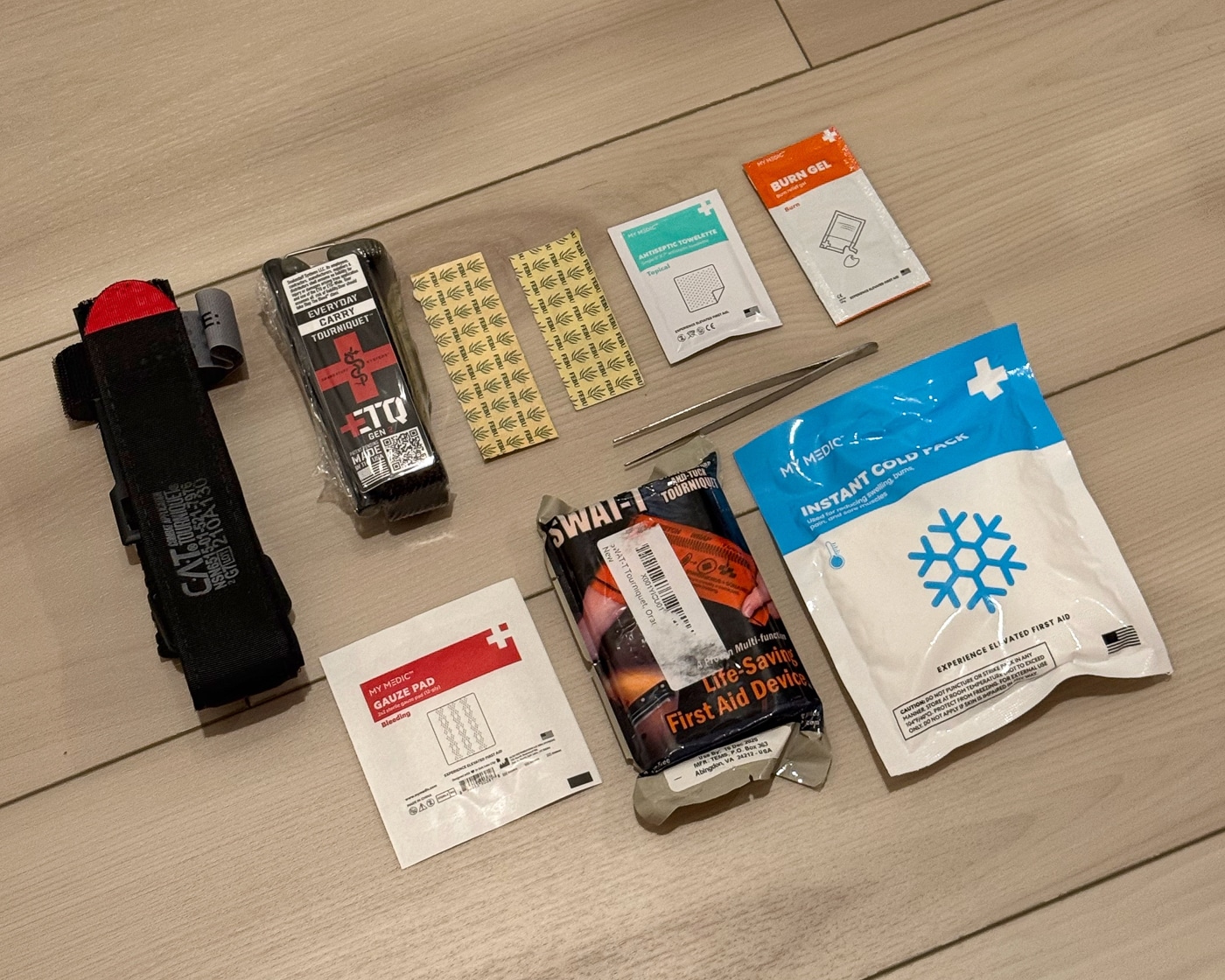 first aid kit the author carries as EDC as a parent
